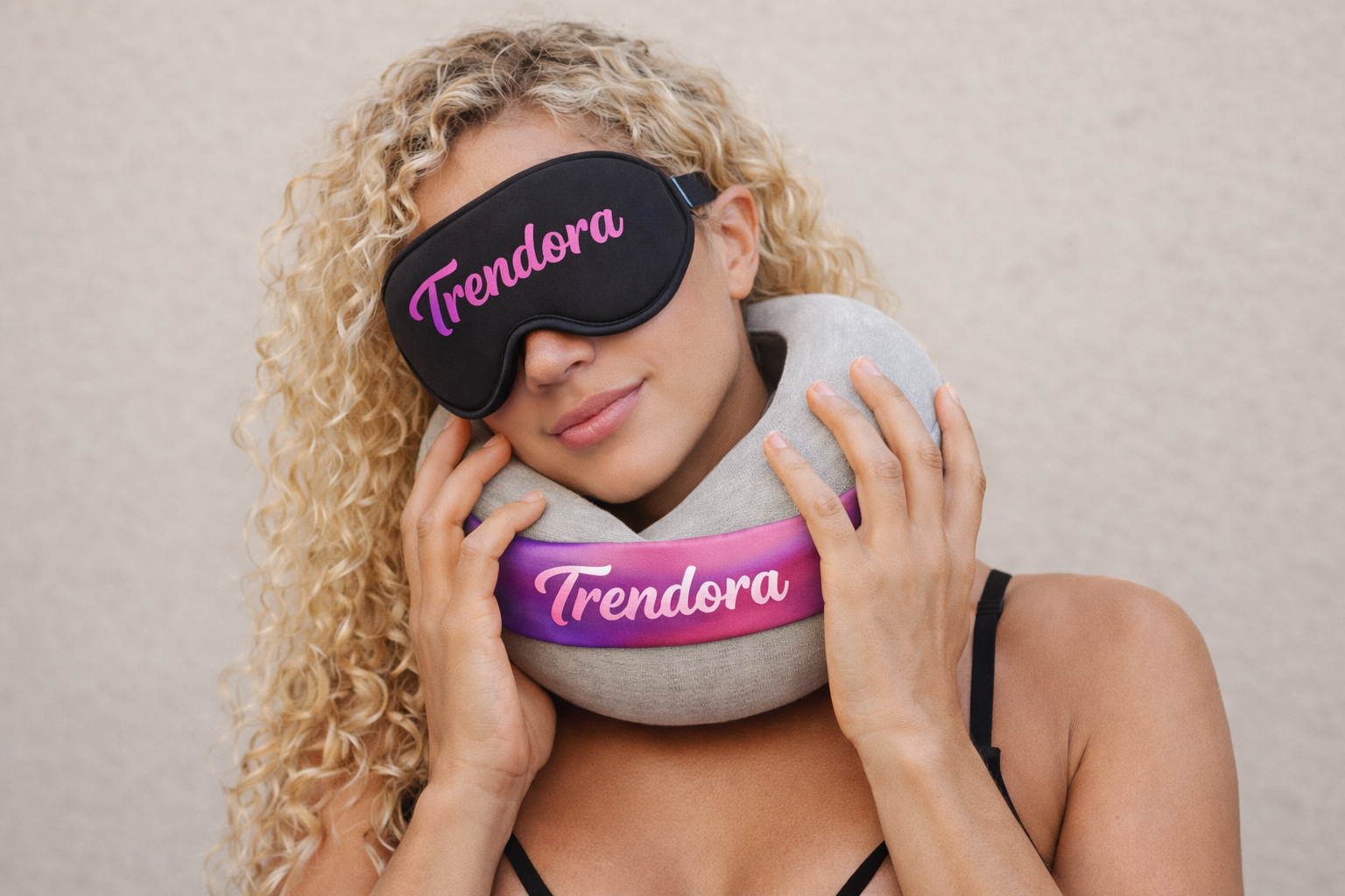 Woman wearing Trendora travel neck pillow and sleep mask with curly blonde hair
